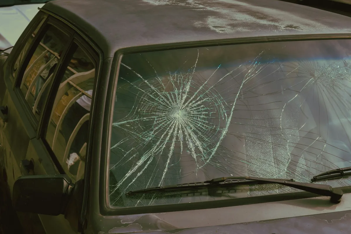 Broken windshield ready for replacement in Bowie
